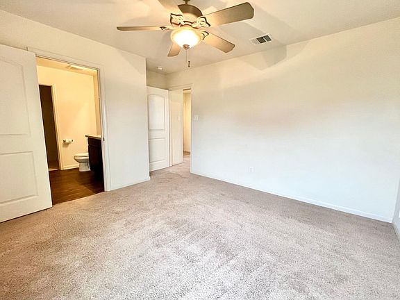 Owners Suite features a ceiling fan, walk in closet and full bathroom!