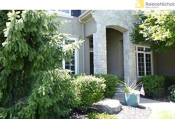 Lush evergreens and gorgeous landscaping.