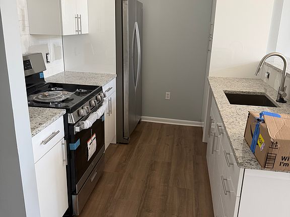 Brand new hardwood floors throughout and freshly painted throughout.