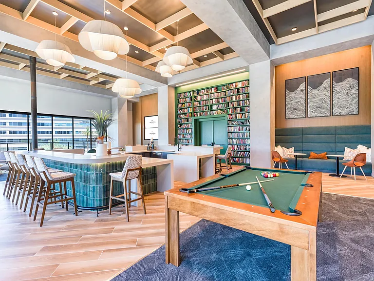 Chic and welcoming, the resident lounge offers stylish spaces to relax, read, sip coffee, or play a game of pool.