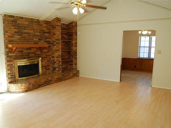 Great fireplace wall in living room with built in shelves