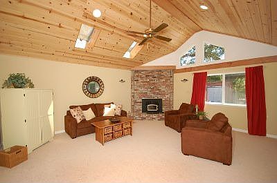 HUGE fam room with raised ceilings & skylights