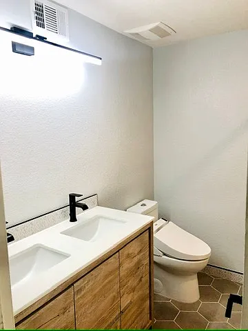 Dual vanity and updated bathroom with toto bidet