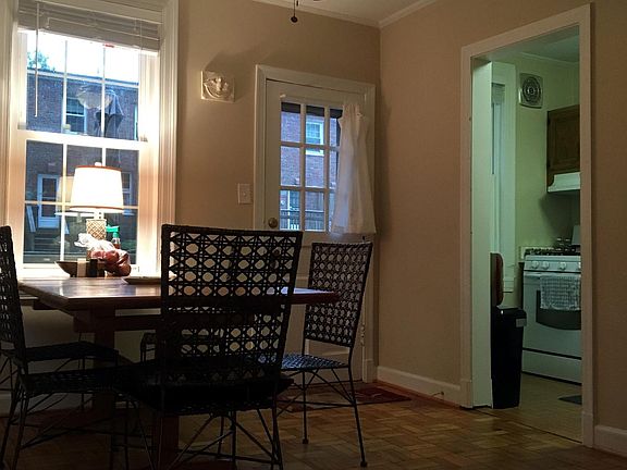 Dining room with lighted ceiling fan and access to deck.