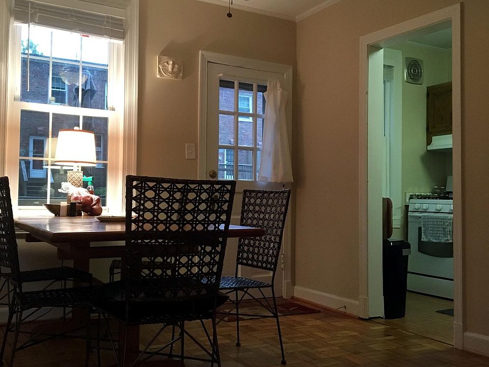 Dining room with lighted ceiling fan and access to deck.