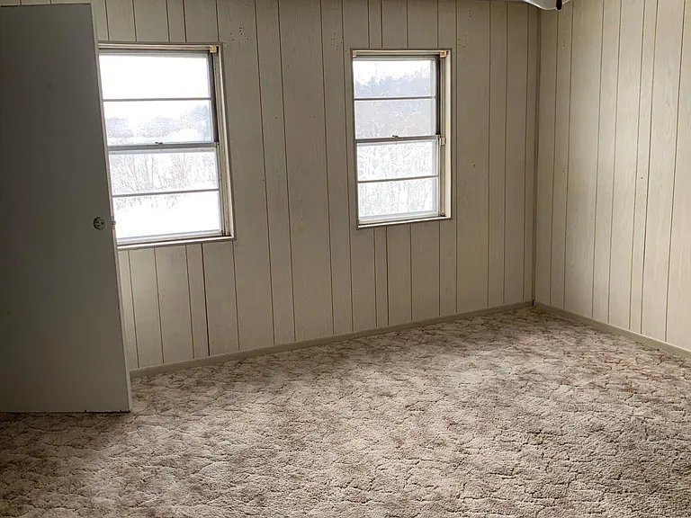 Large 2nd bedroom with a big corner closet.