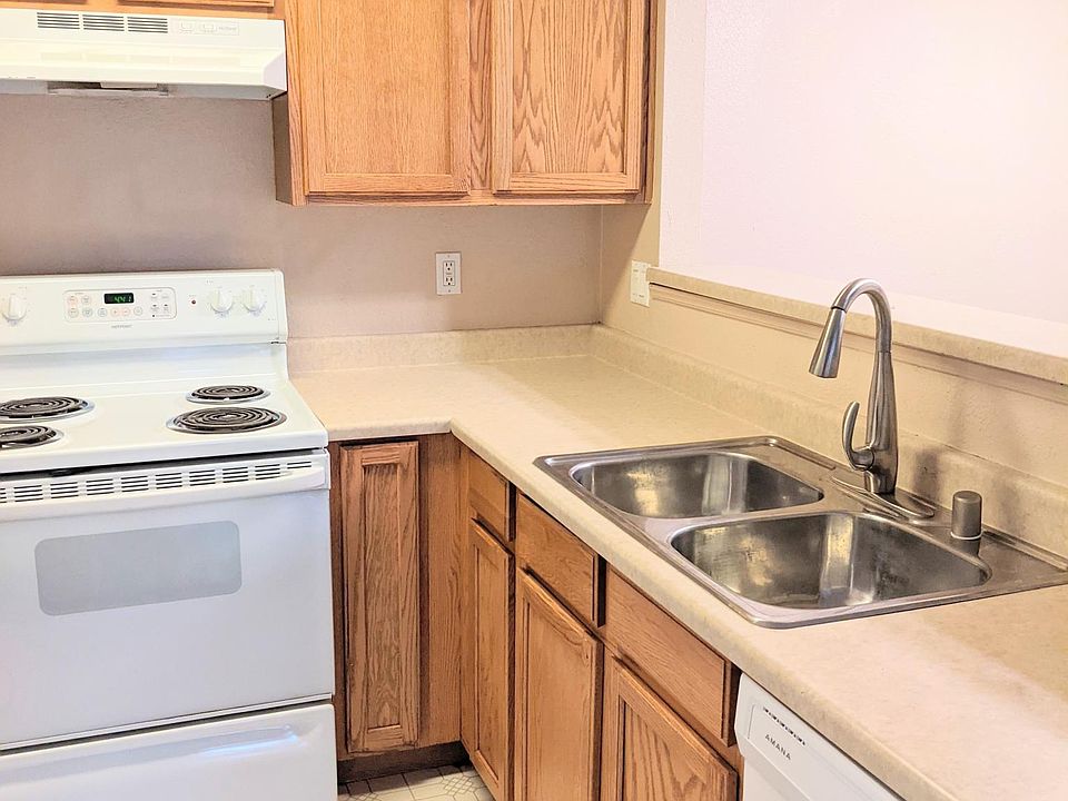 Kitchen overlooking breakfast bar into dining area