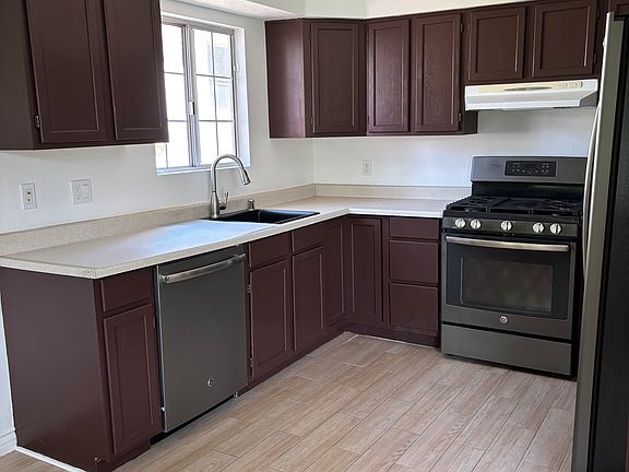 Kitchen View. Includes refrigerator, stove, dish washer.