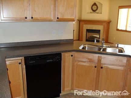 Kitchen looking into living room