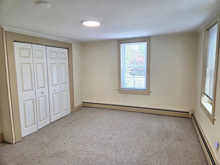 Bedroom 2 with large closet, updated lighting and fresh paint