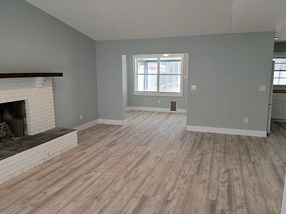 Family room leading into bonus room to the back