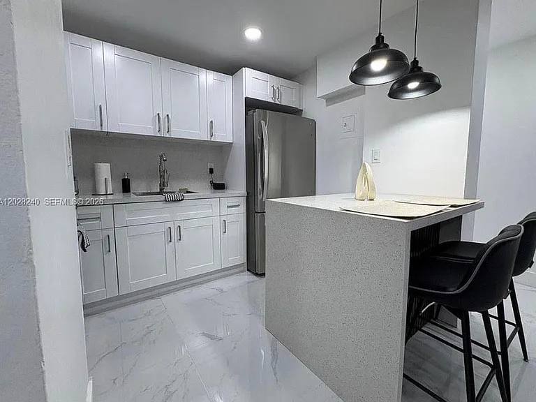 4265 NW South Tamiami Canal Dr #211 — Photo 1