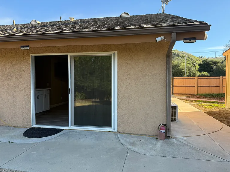 Broader view of unit with private entry walkway
