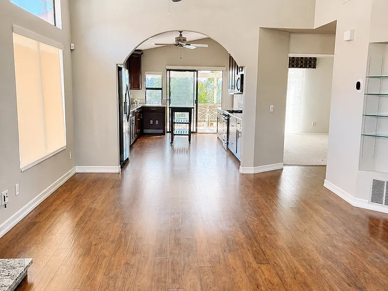 View front to back of house from living room into kitchen