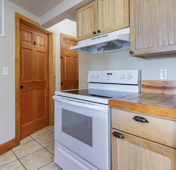 View from kitchen toward laundry room and bathroom.