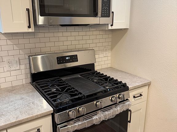 All new stainless appliances including gas stove