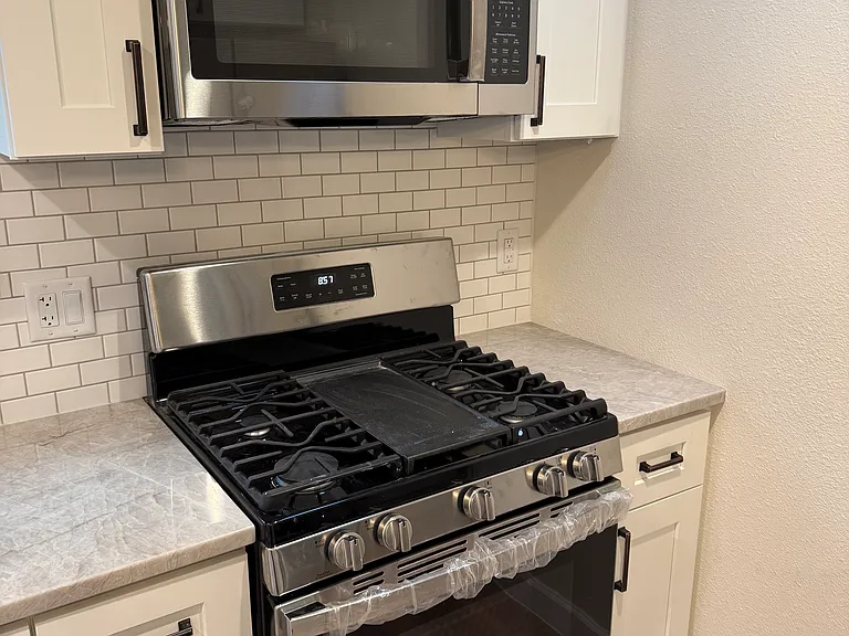 All new stainless appliances including gas stove