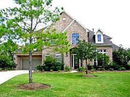 Front view, yard has been landscaped with more plants since photo.