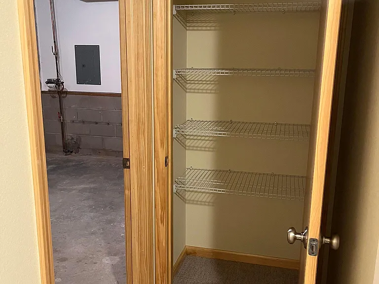 Lower level storage closet and utility/storage room.