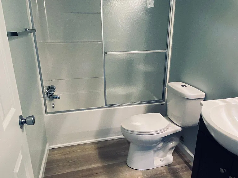 water saving toilet and sliding shower and tub doors