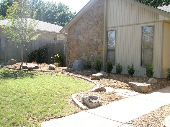 Professionally Landscaped flowerbeds