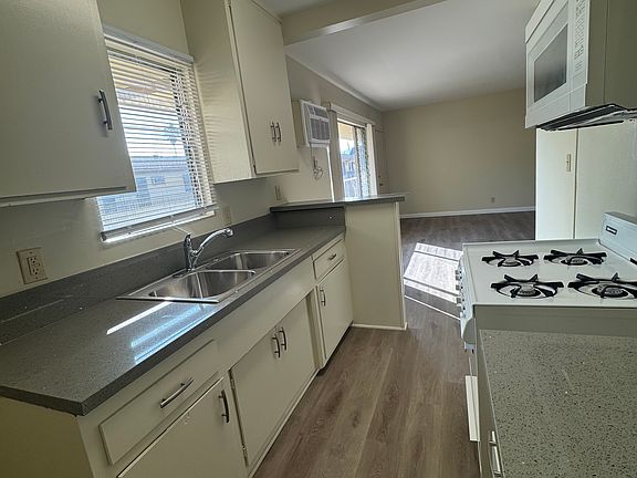 Kitchen with new quartz countertops and new built-in microwave