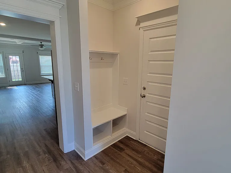 Mud-room nook in front of entrance to garage