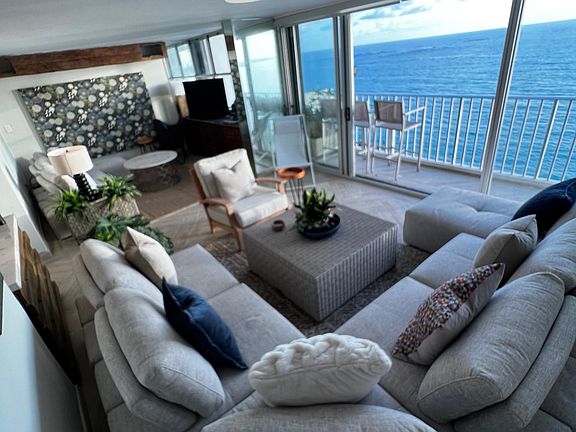 The living room / media room with lots of seating and views.