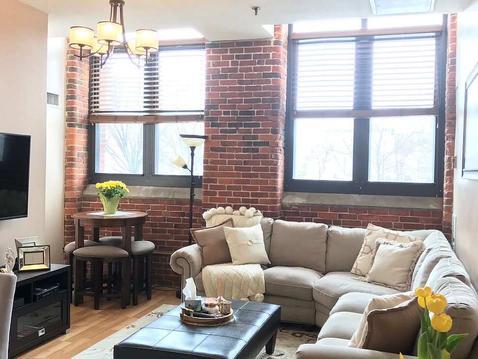 Sun filled living room/ with exposed brick.