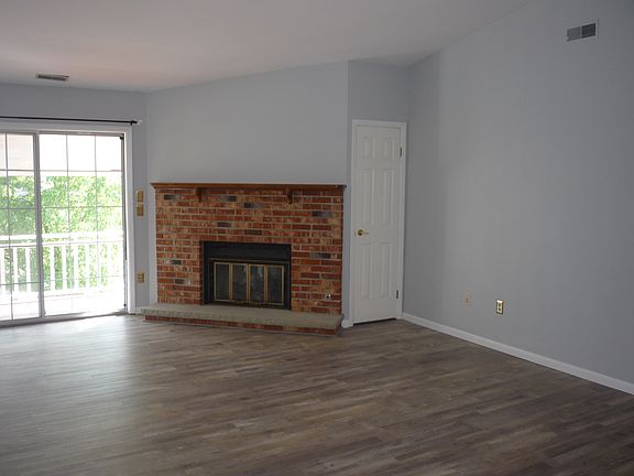 Gas insert fireplace. Slider to the balcony.