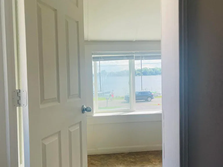 View from the top of the stairs into the upstairs half bath