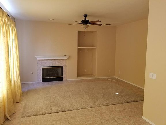 den -- the kitchen opens into this room