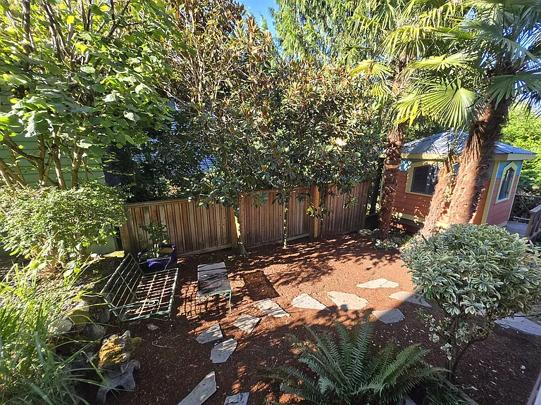 Side garden view off of the covered deck