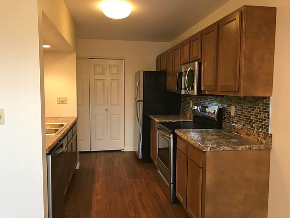 looking into kitchen from patio door, laundry closet at back