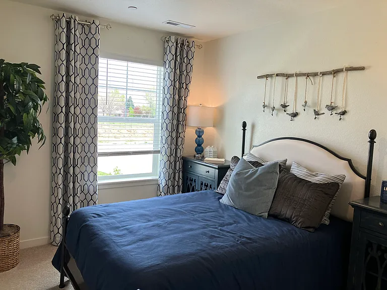 Sample of same floor plan, different finishes, staged with furniture.