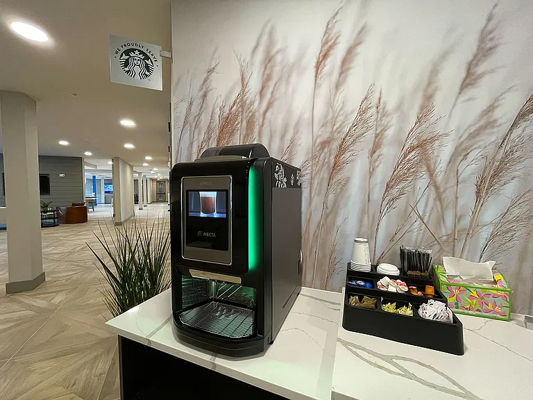 Experience luxury living with complimentary coffee in our stylish apartment lobby.