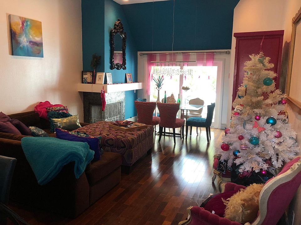 View of living room and dining room from front door