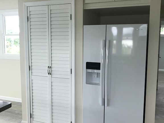 Kitchen pantry.
Side by side refrigerator/freezer.