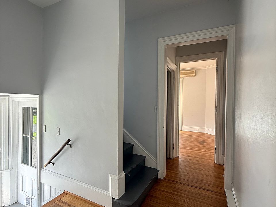 Going left after entering the apartment takes you to the stairs, hallway closet and front room