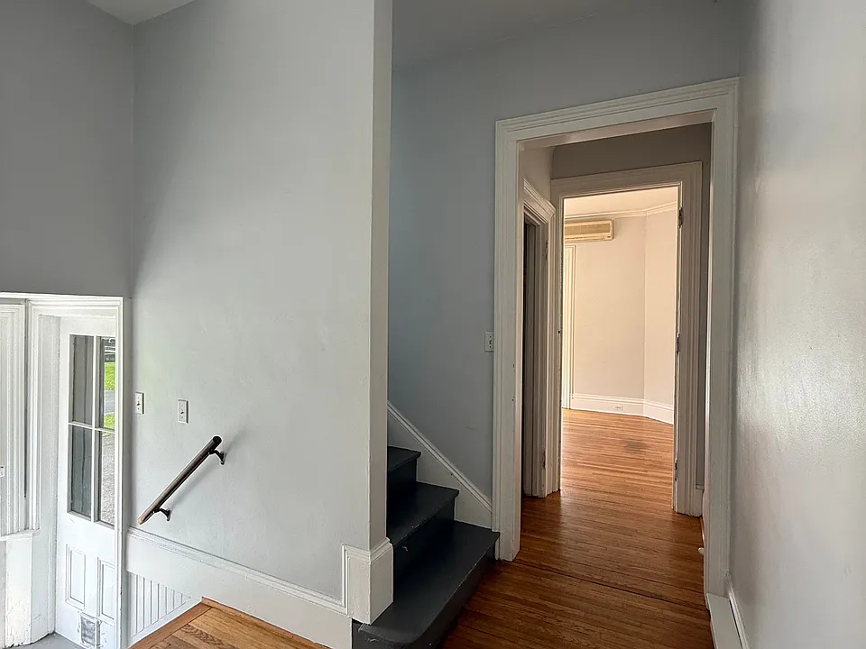 Going left after entering the apartment takes you to the stairs, hallway closet and front room