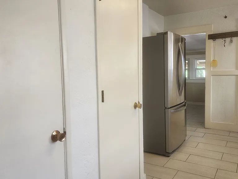 Kitchen view 3 - pantry and utility closet