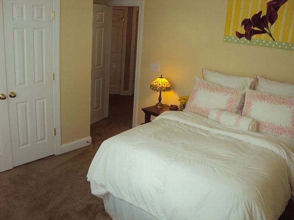 Bedroom #2 with pitched ceiling, crown molding, big closet.