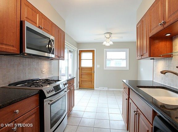 4th image of 8816 N Ozanam Ave