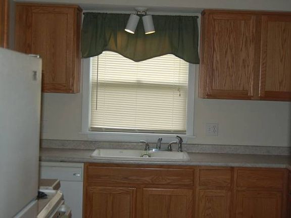 The kitchen has plenty of cabinets and counter space.