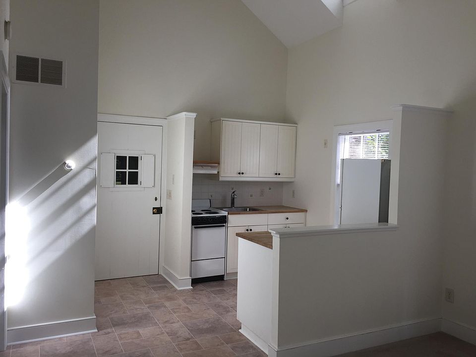 View of kitchen & entry door from living room