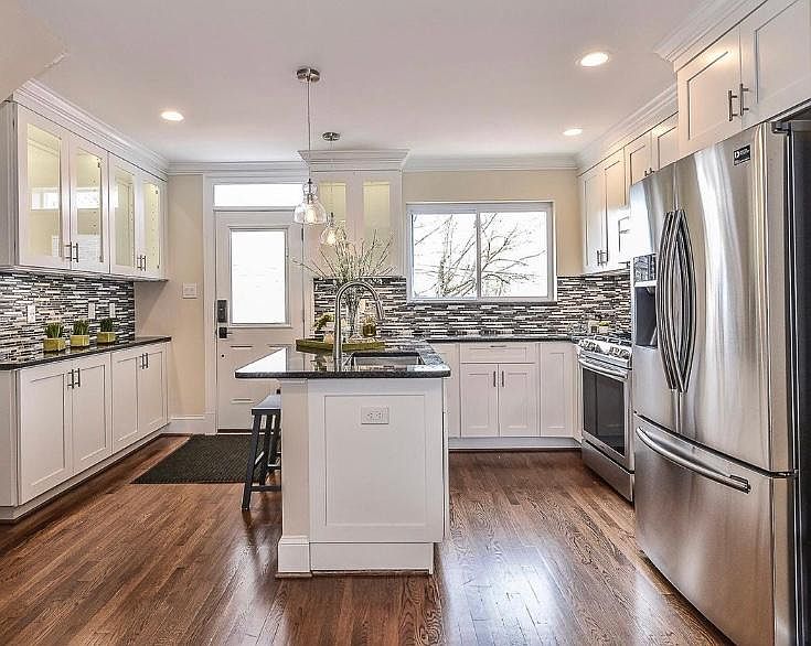 Kitchen with SS appliances and breakfast bar