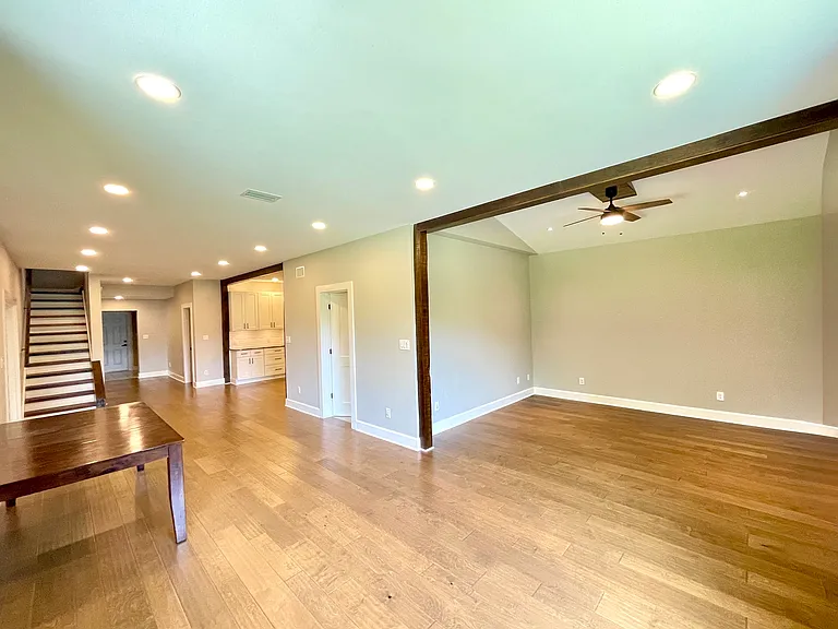 Open living/dining area with large windows