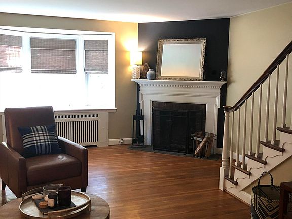 Living Room: wood burning fireplace, newer grey bamboo blind