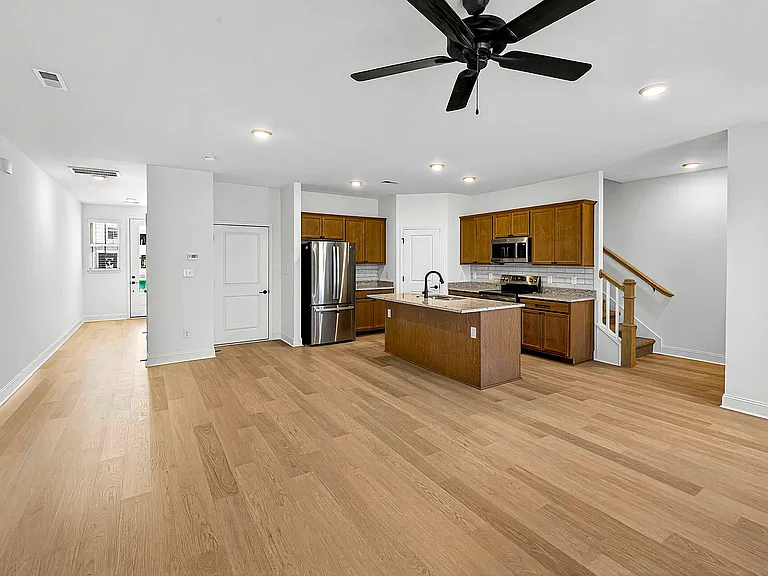 Open concept plan with modern Luxury Vinyl Plank flooring