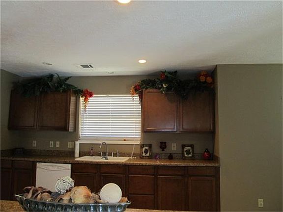 VIEW OF KITCHEN FROM LIVING ROOM